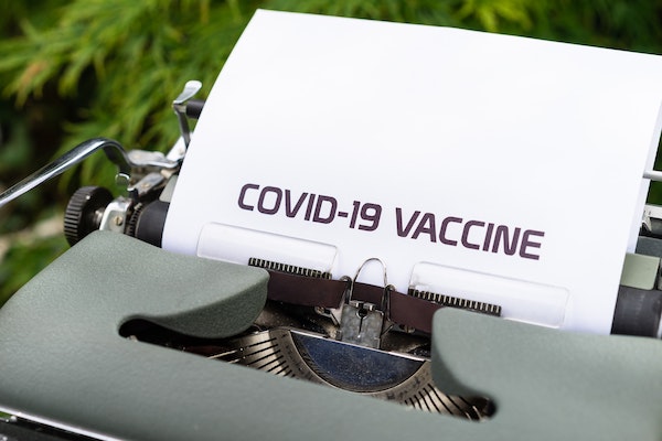 COVID-19 vaccine printed on typewriter